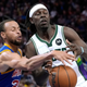Steph Curry (l.) strips the ball from the hands of Jrue Holliday.